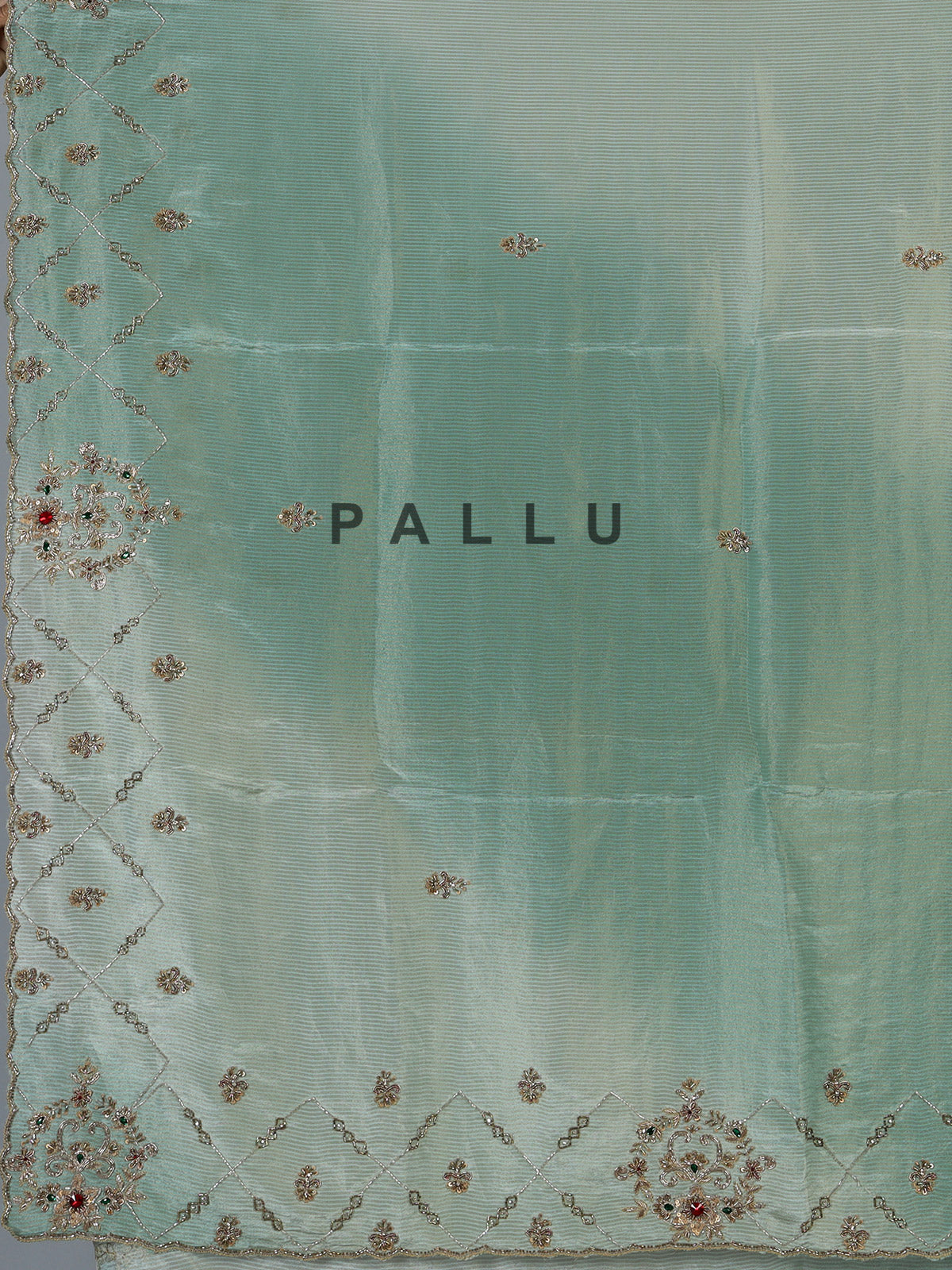Pista green shimmer dola silk saree with elegant festive embellishments