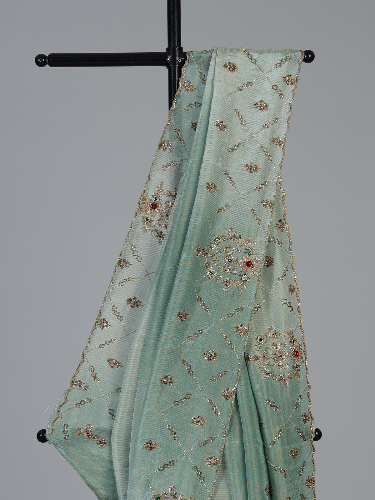 Pista green shimmer dola silk saree with elegant festive embellishments