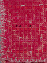 Rani pink bandhani dola silk saree with luxurious festive elegance