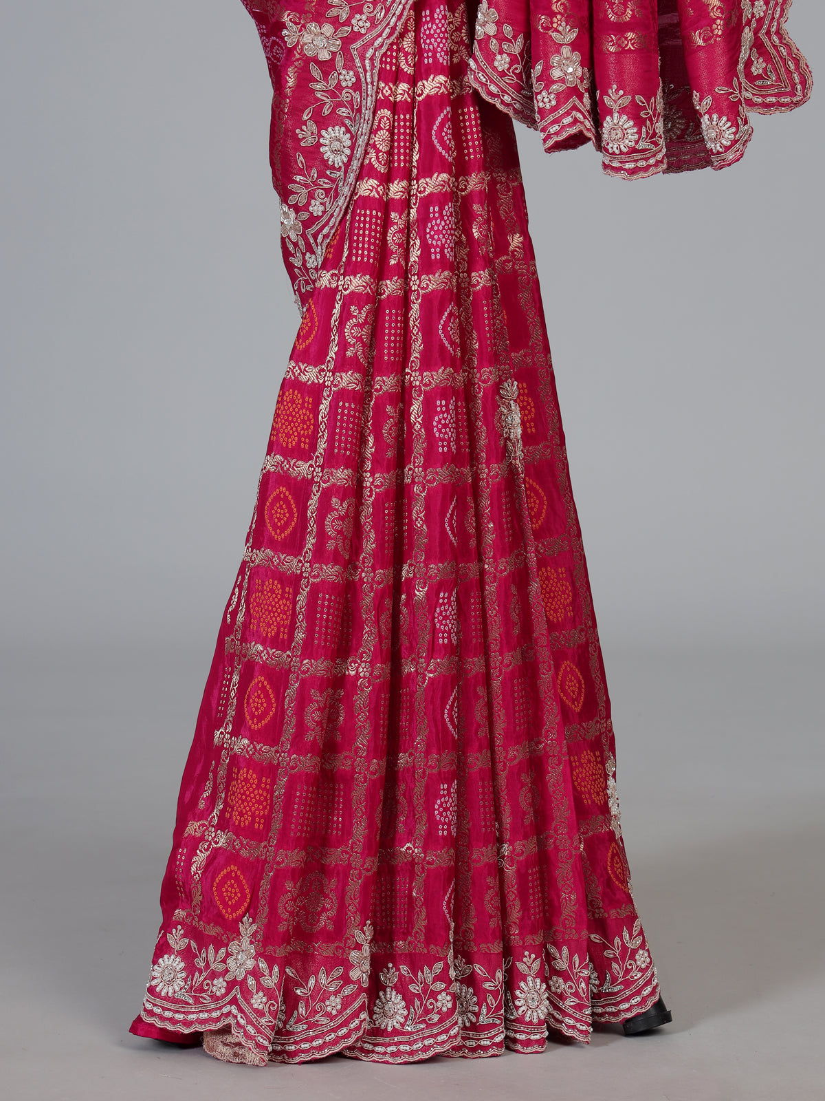 Rani pink bandhani dola silk saree with luxurious festive elegance