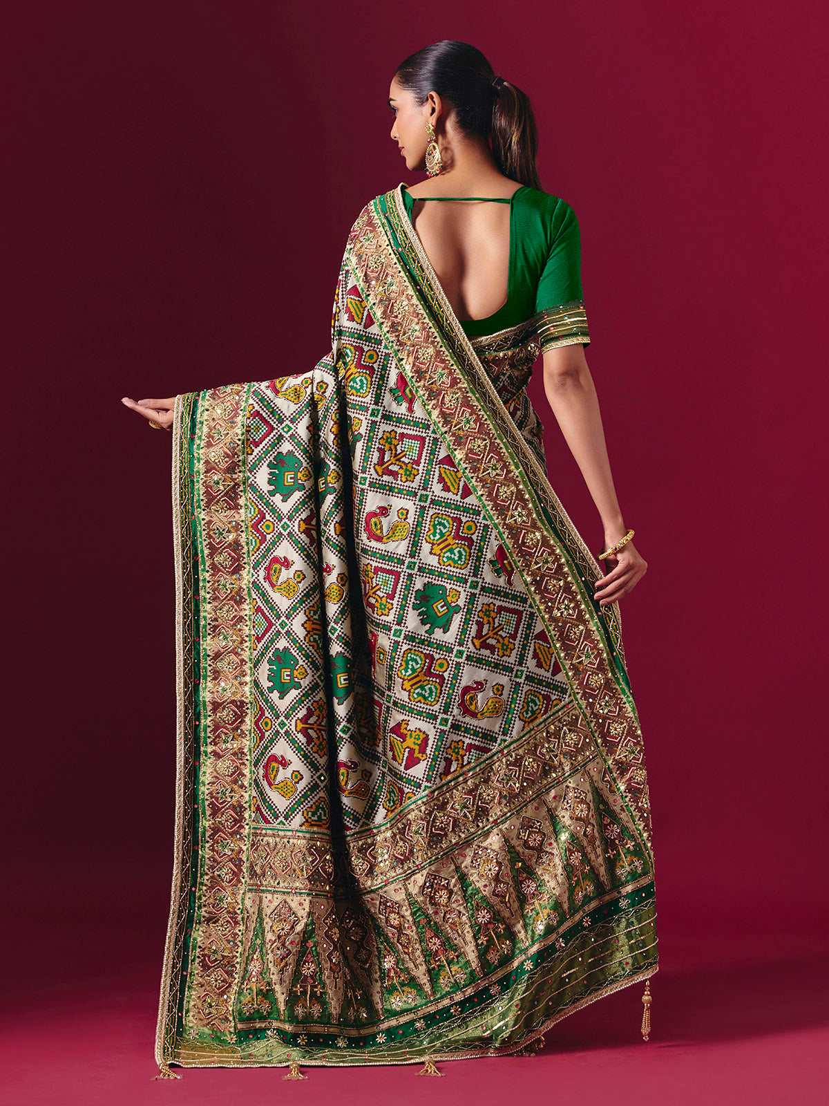 Green art patola silk saree with animal and bird motif artistry