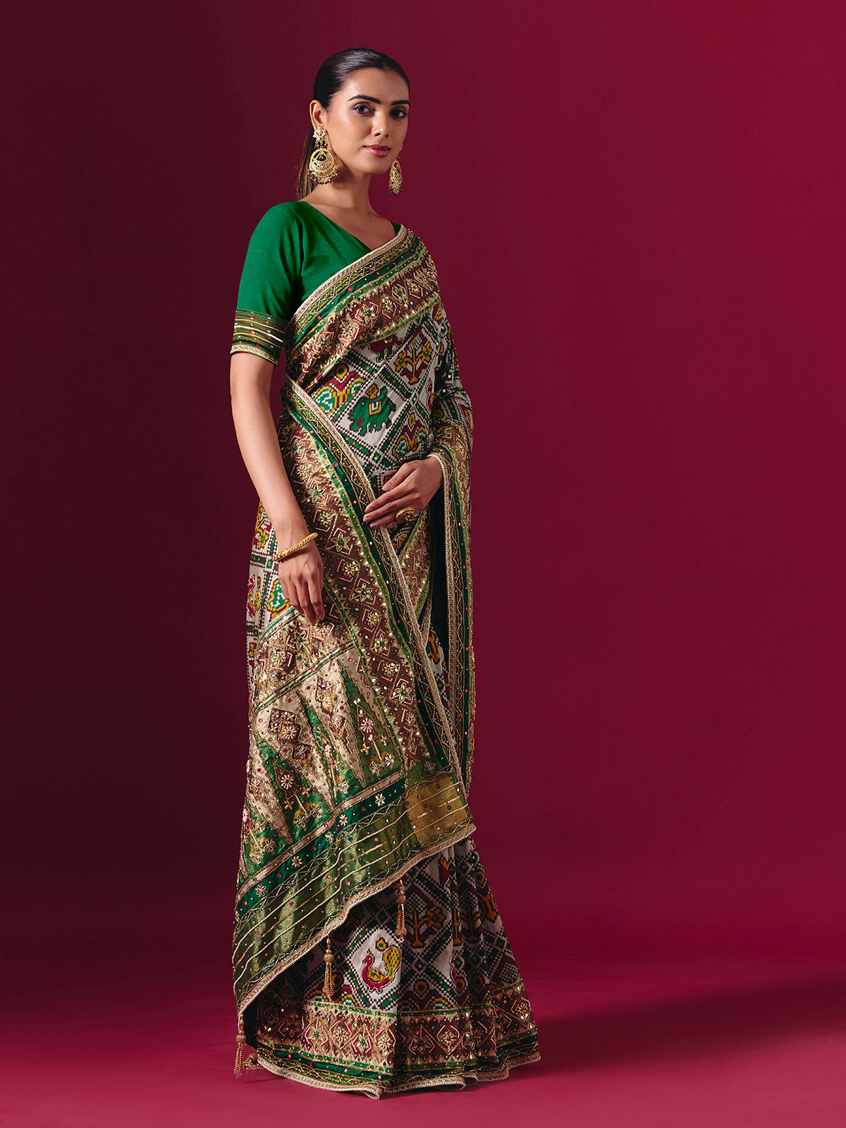 Green art patola silk saree with animal and bird motif artistry