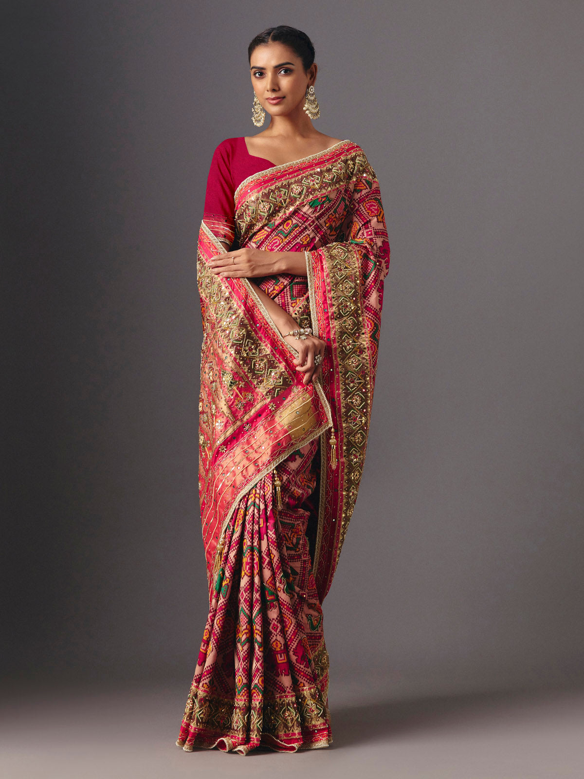 Rani pink art patola silk saree with elegant animal and bird motifs