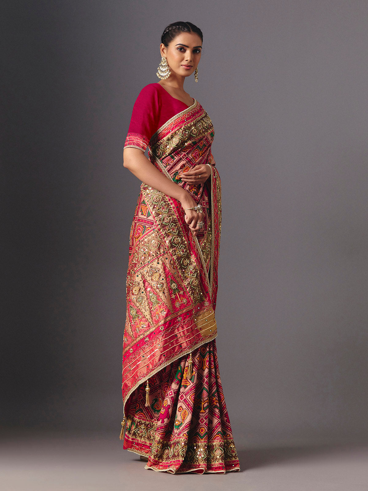 Rani pink art patola silk saree with elegant animal and bird motifs