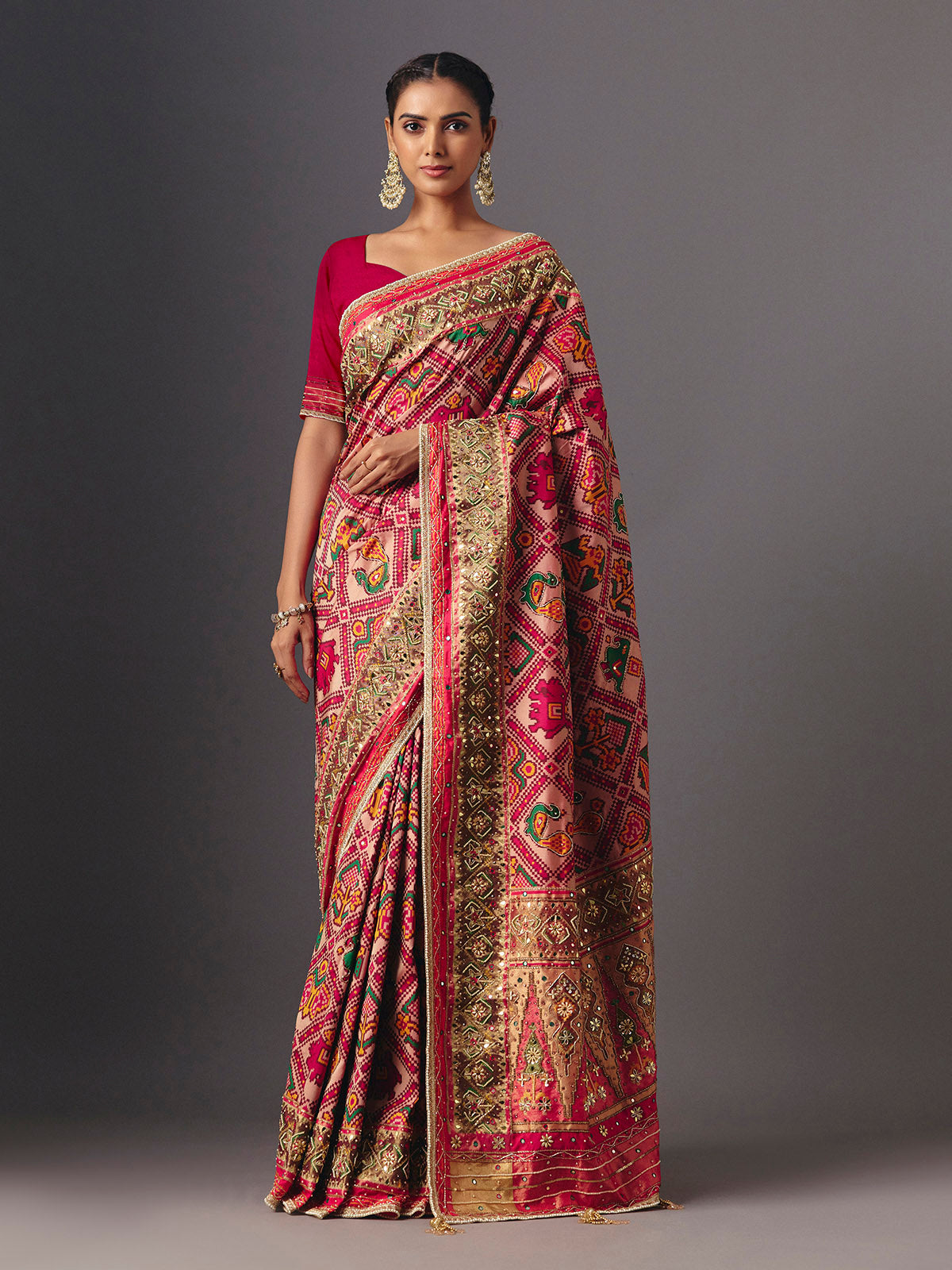 Rani pink art patola silk saree with elegant animal and bird motifs