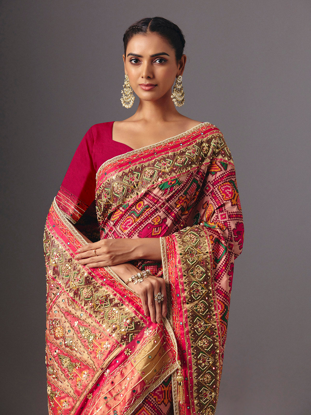 Rani pink art patola silk saree with elegant animal and bird motifs