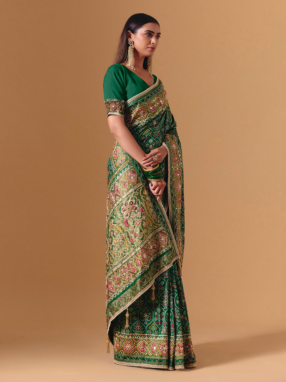 Green art silk patola print saree with timeless festive elegance