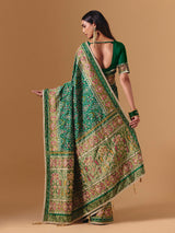 Green art silk patola print saree with timeless festive elegance