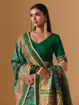 Green art silk patola print saree with timeless festive elegance