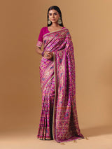 Rani pink art silk saree with graceful patola motif detailing