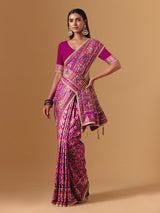 Rani pink art silk saree with graceful patola motif detailing