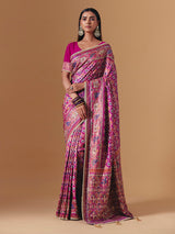 Rani pink art silk saree with graceful patola motif detailing