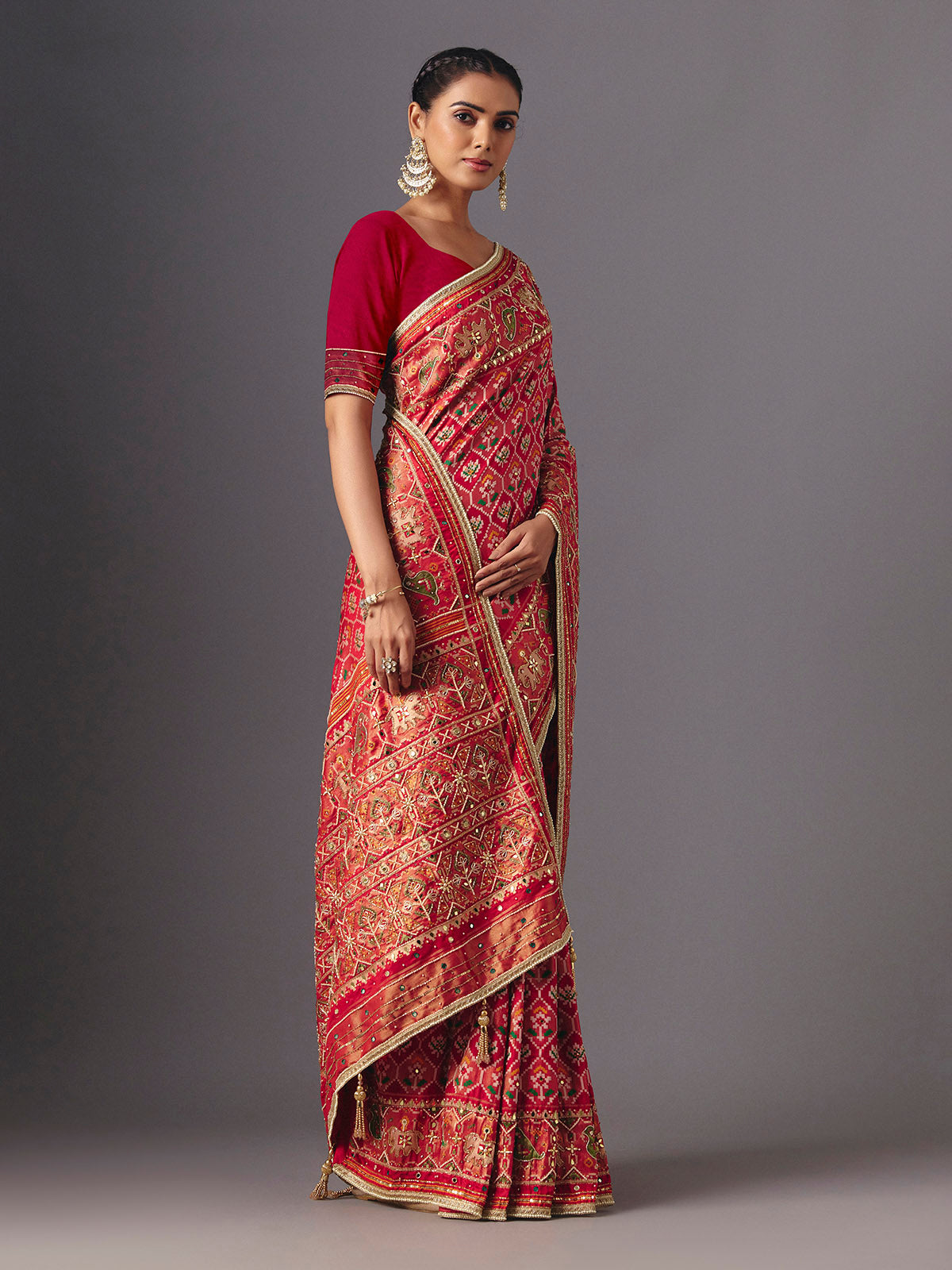 Red art silk patola saree with traditional animal and bird artistry