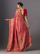Red art silk patola saree with traditional animal and bird artistry