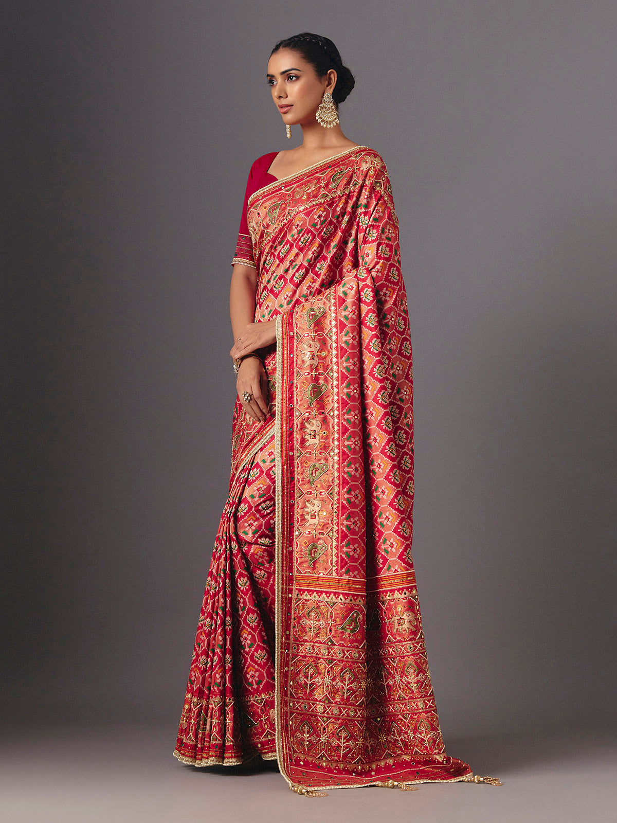 Red art silk patola saree with traditional animal and bird artistry