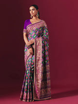 Purple and green art patola silk saree with festive motifs