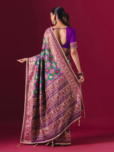 Purple and green art patola silk saree with festive motifs