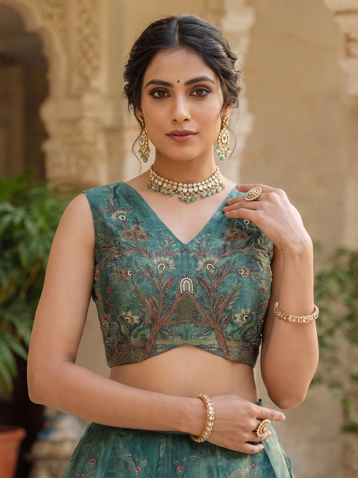 Teal green pichwai printed crepe silk lehenga choli ensemble