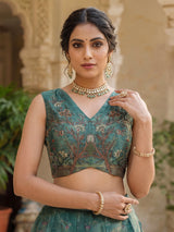 Teal green pichwai printed crepe silk lehenga choli ensemble