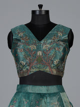 Teal green pichwai printed crepe silk lehenga choli ensemble