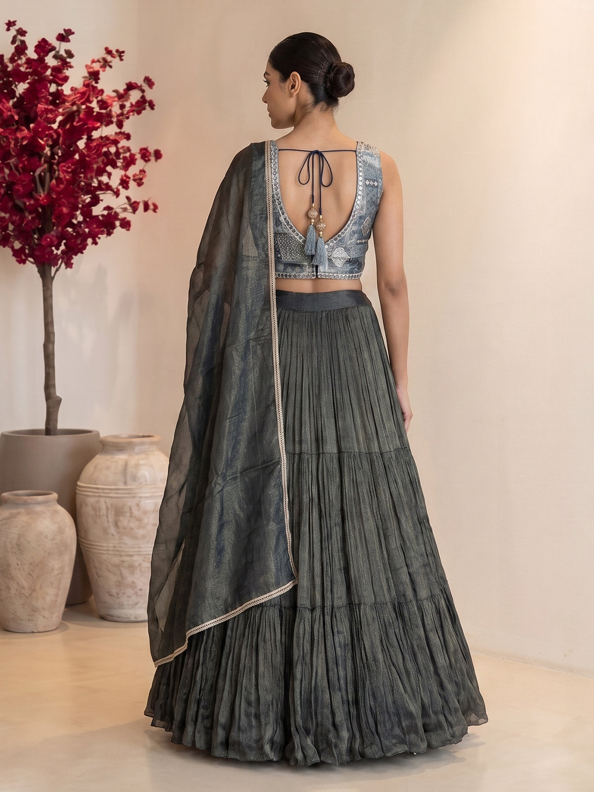 Bottle green tiered crepe silk designer lehenga creation