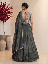 Bottle green tiered crepe silk designer lehenga creation
