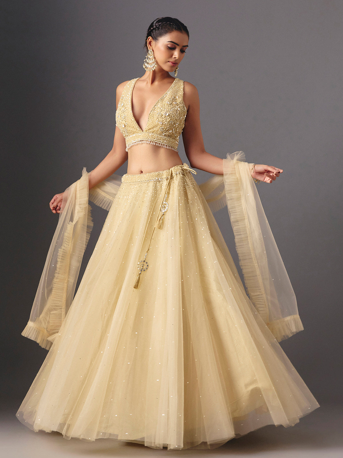 Yellow net designer lehenga choli with elegant dupatta for celebrations