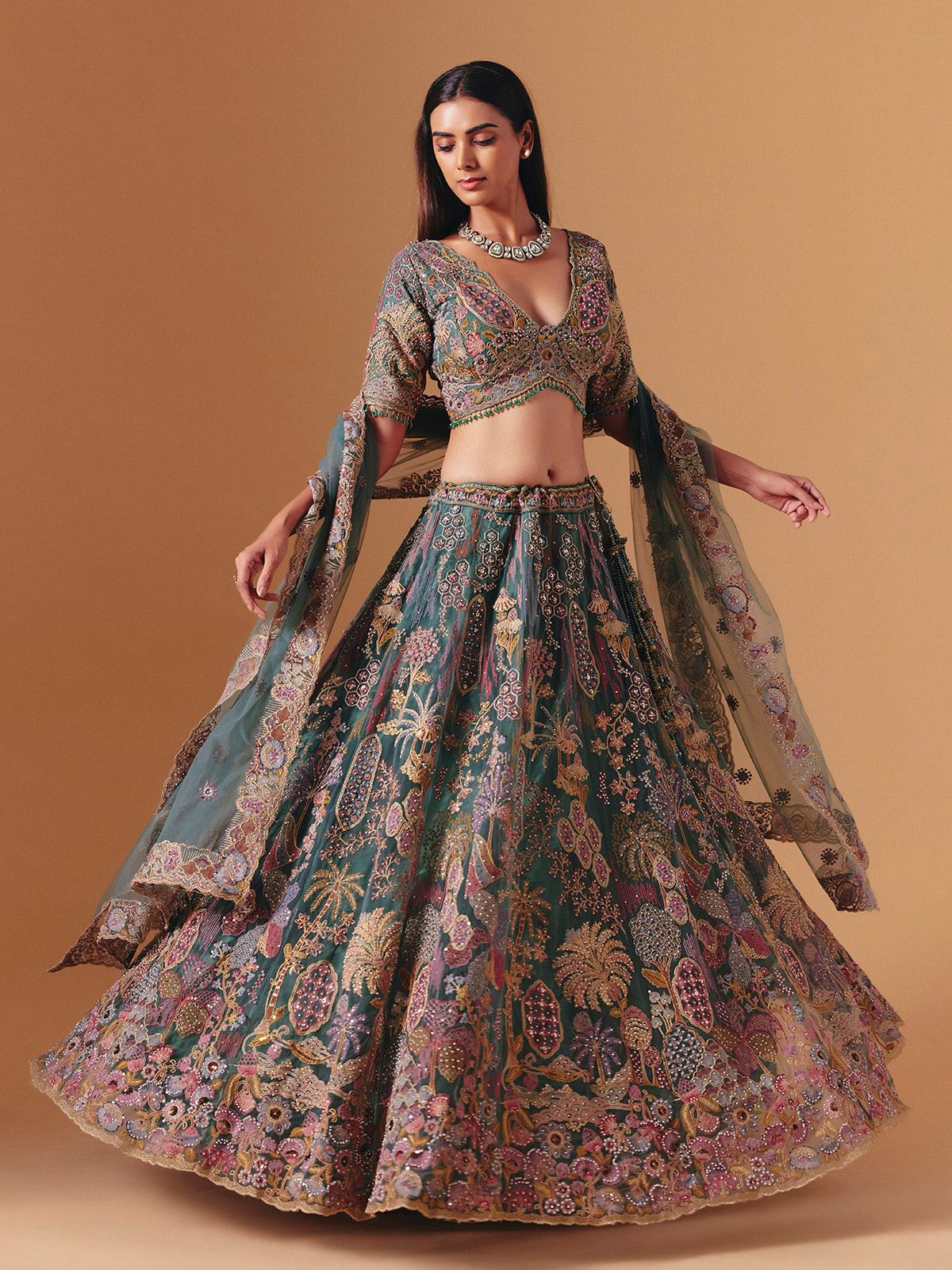 Teal green net designer lehenga choli with elegant dupatta grace