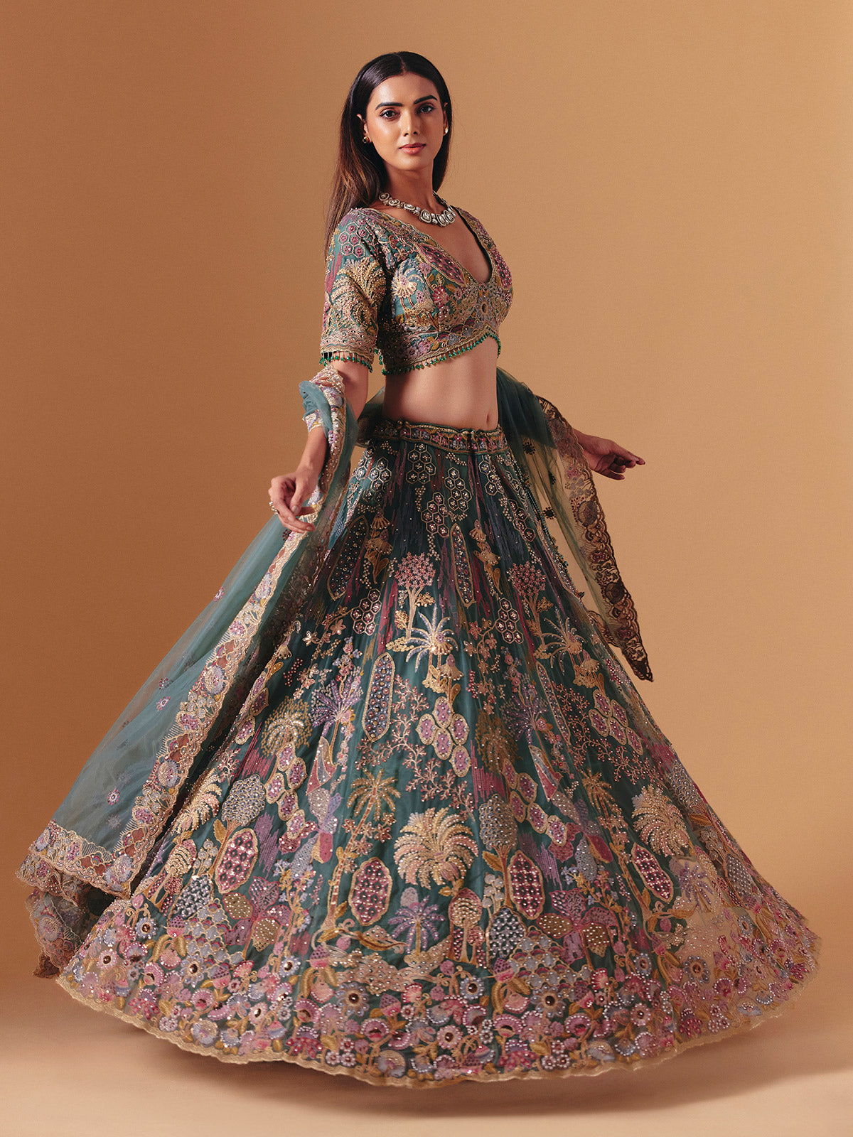 Teal green net designer lehenga choli with elegant dupatta grace