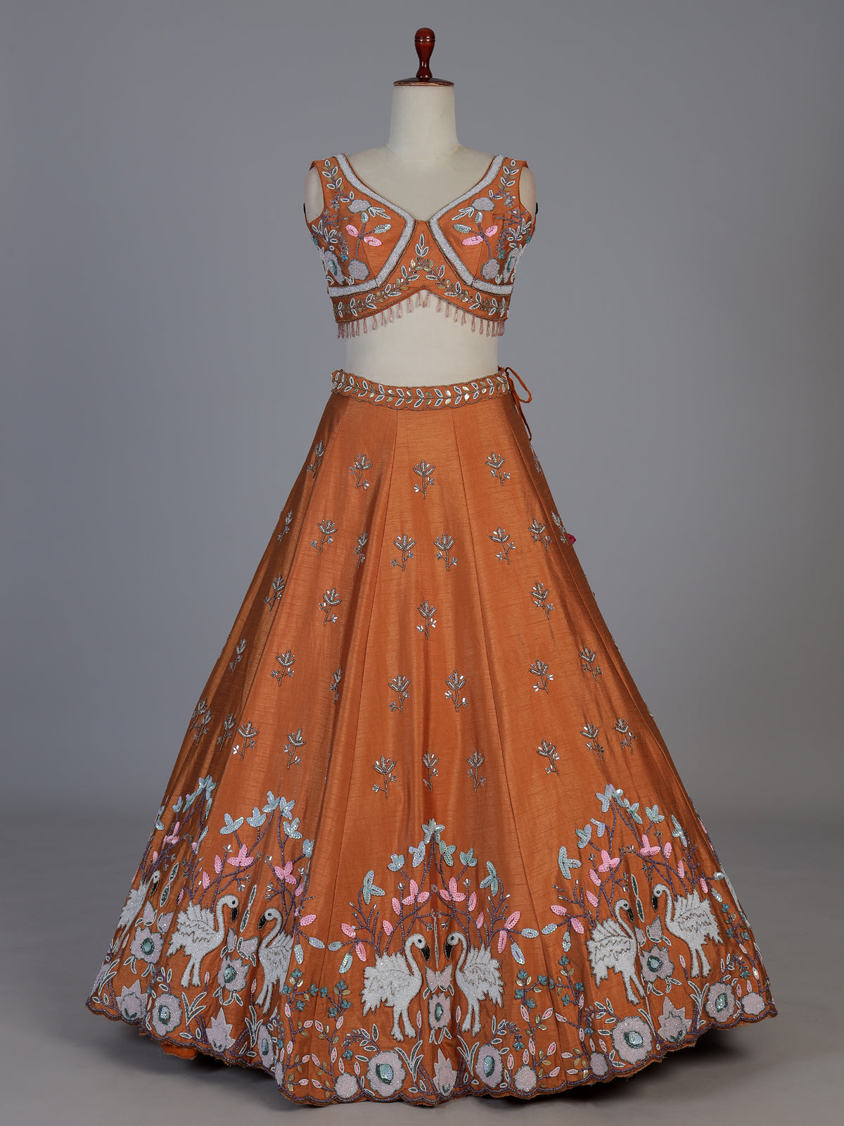 Rust orange raw silk swan motif lehenga choli with dupatta