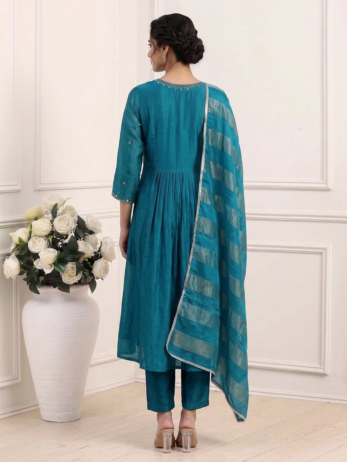 Teal blue tissue yoke kurti set with intricate festive detailing