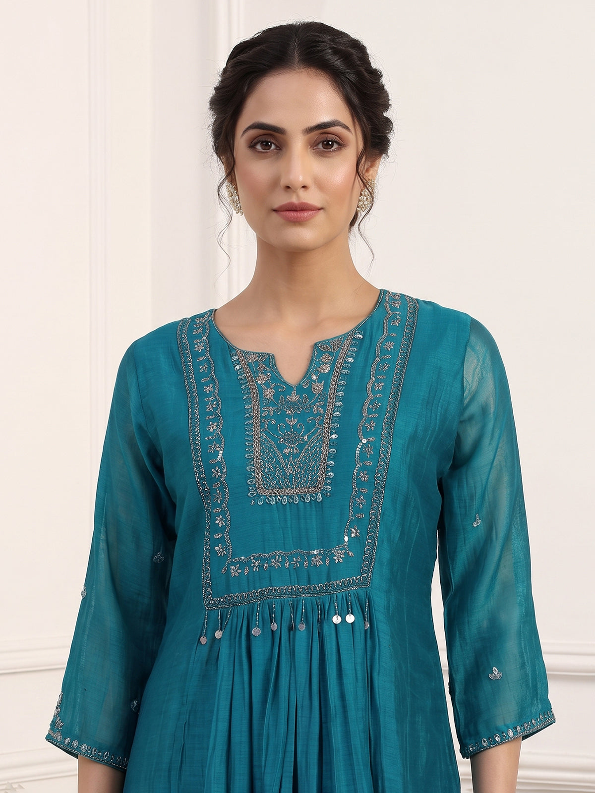 Teal blue tissue yoke kurti set with intricate festive detailing