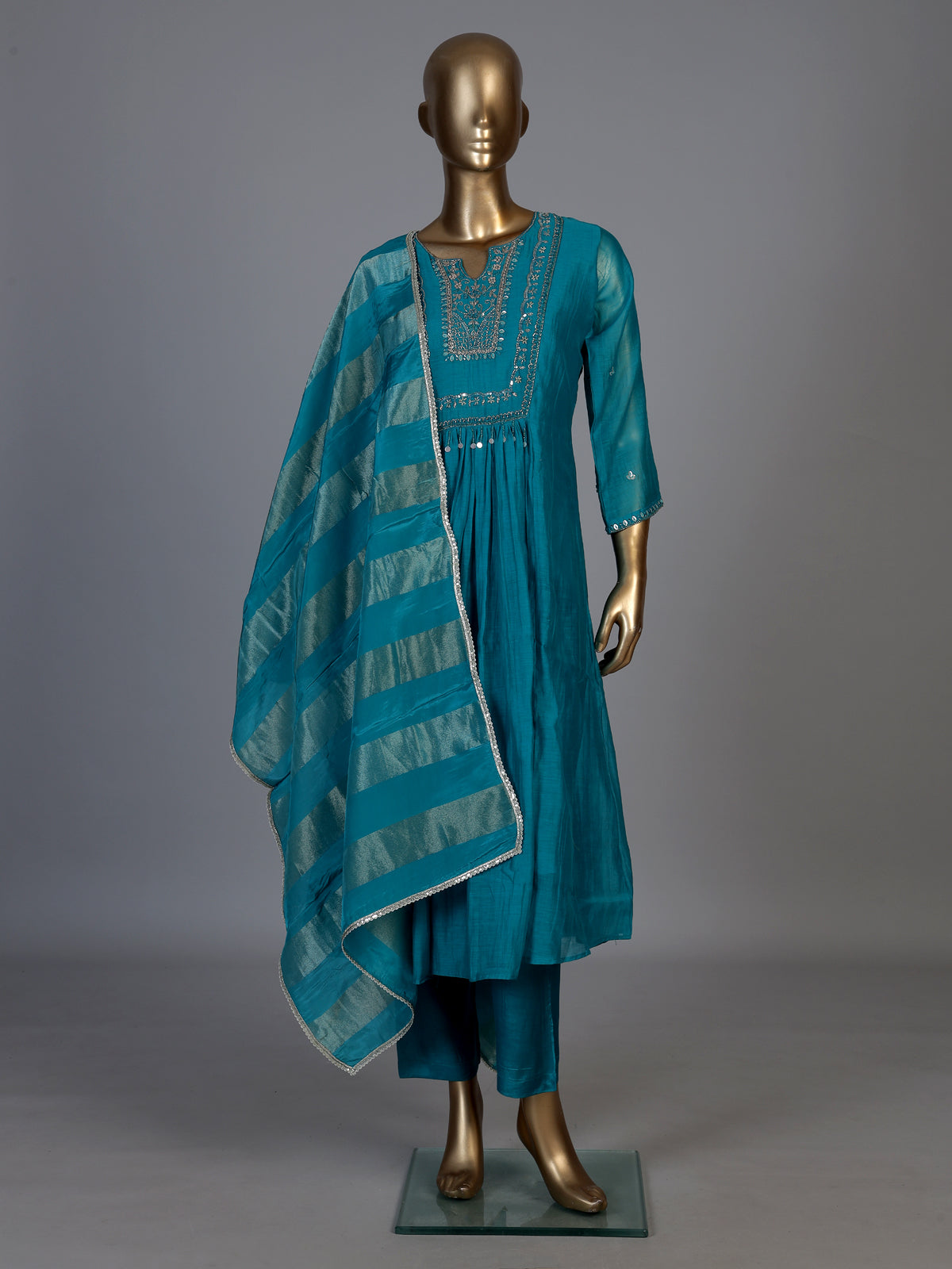 Teal blue tissue yoke kurti set with intricate festive detailing