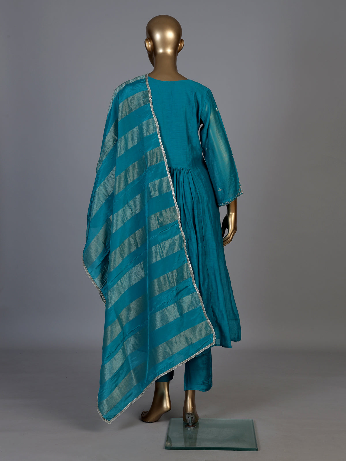 Teal blue tissue yoke kurti set with intricate festive detailing