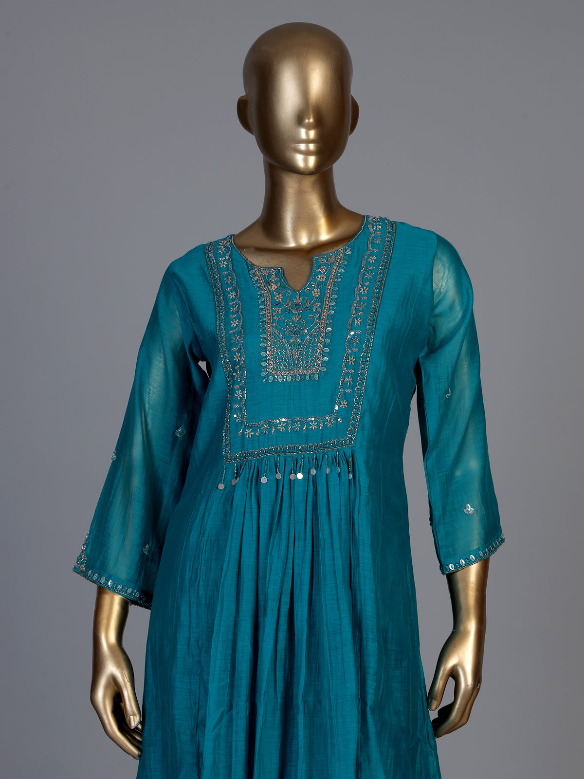 Teal blue tissue yoke kurti set with intricate festive detailing