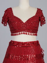 Maroon net designer lehenga choli with stone work tassel detailing