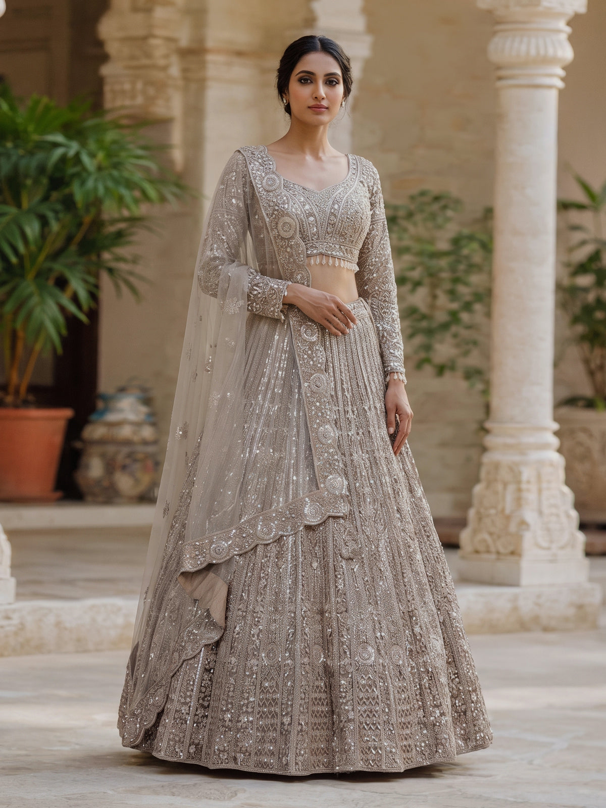Beige net designer lehenga choli with diamond work embellishments