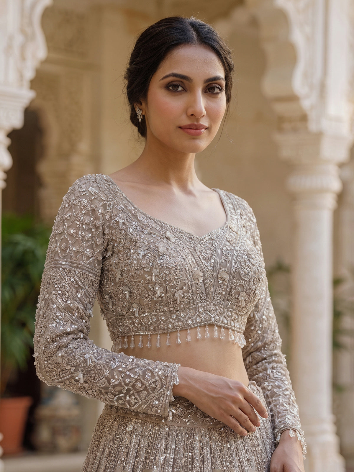 Beige net designer lehenga choli with diamond work embellishments
