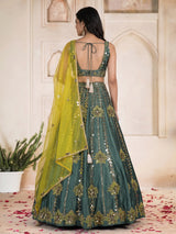 Green silk lehenga choli with mirror patchwork and contrast dupatta
