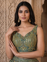 Green silk lehenga choli with mirror patchwork and contrast dupatta