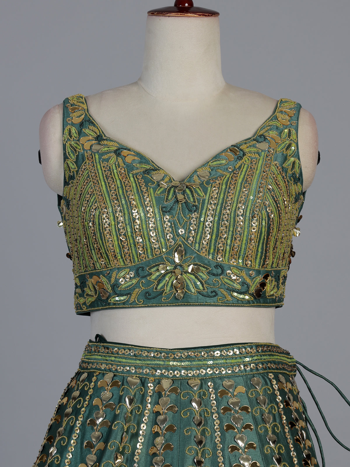 Green silk lehenga choli with mirror patchwork and contrast dupatta