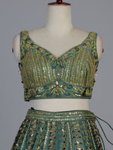 Green silk lehenga choli with mirror patchwork and contrast dupatta
