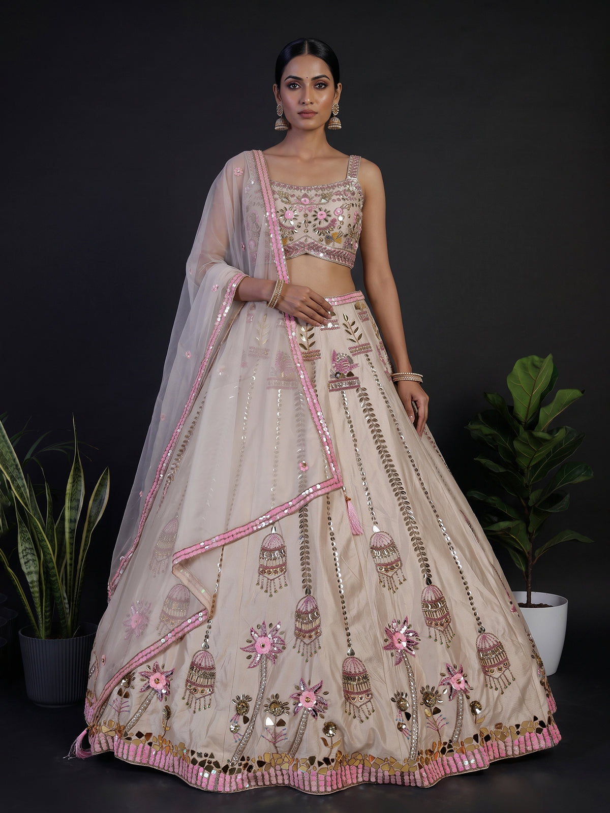 Beige silk lehenga choli with zardosi and mirror embellishments