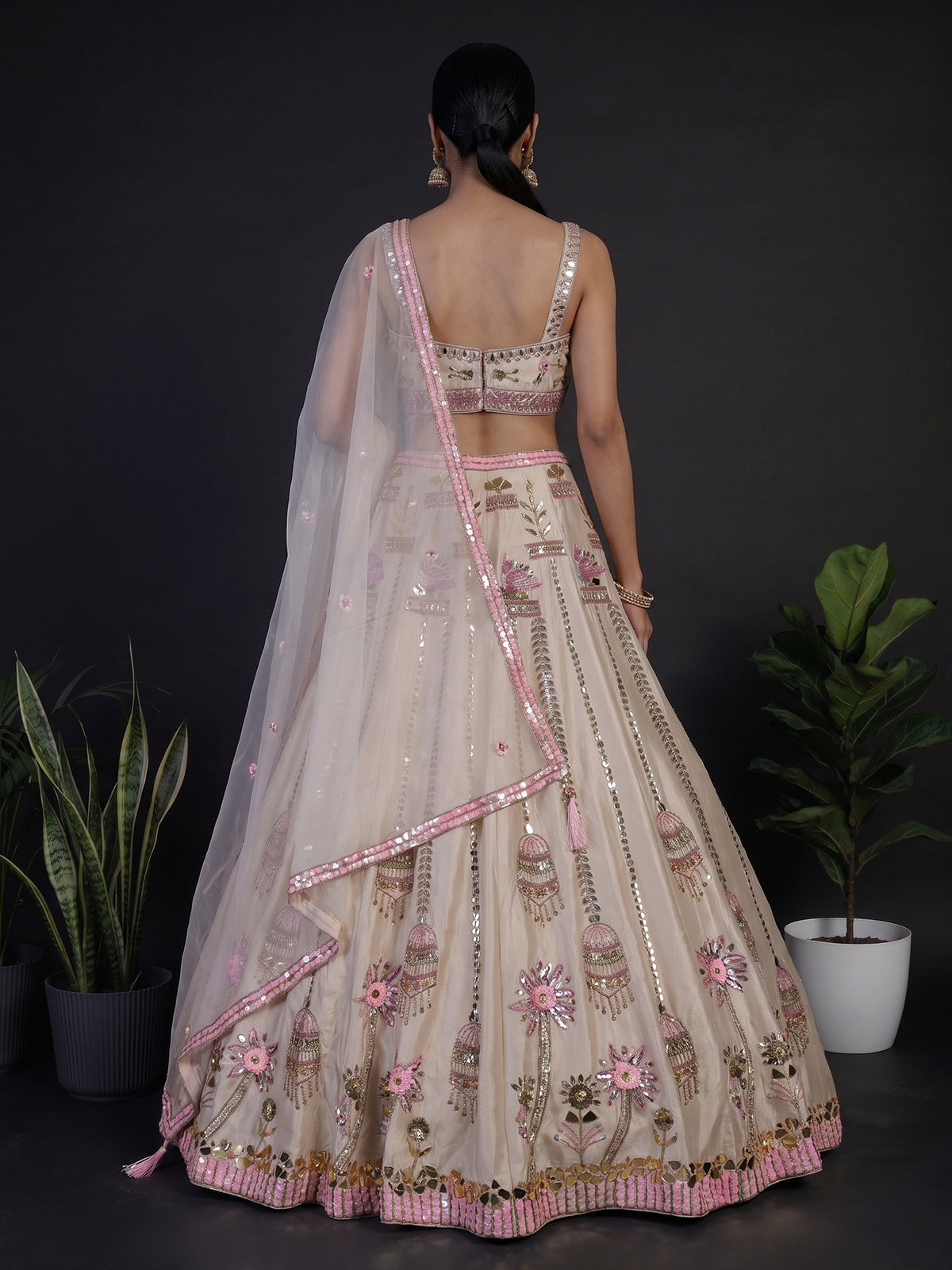 Beige silk lehenga choli with zardosi and mirror embellishments