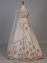 Beige silk lehenga choli with zardosi and mirror embellishments