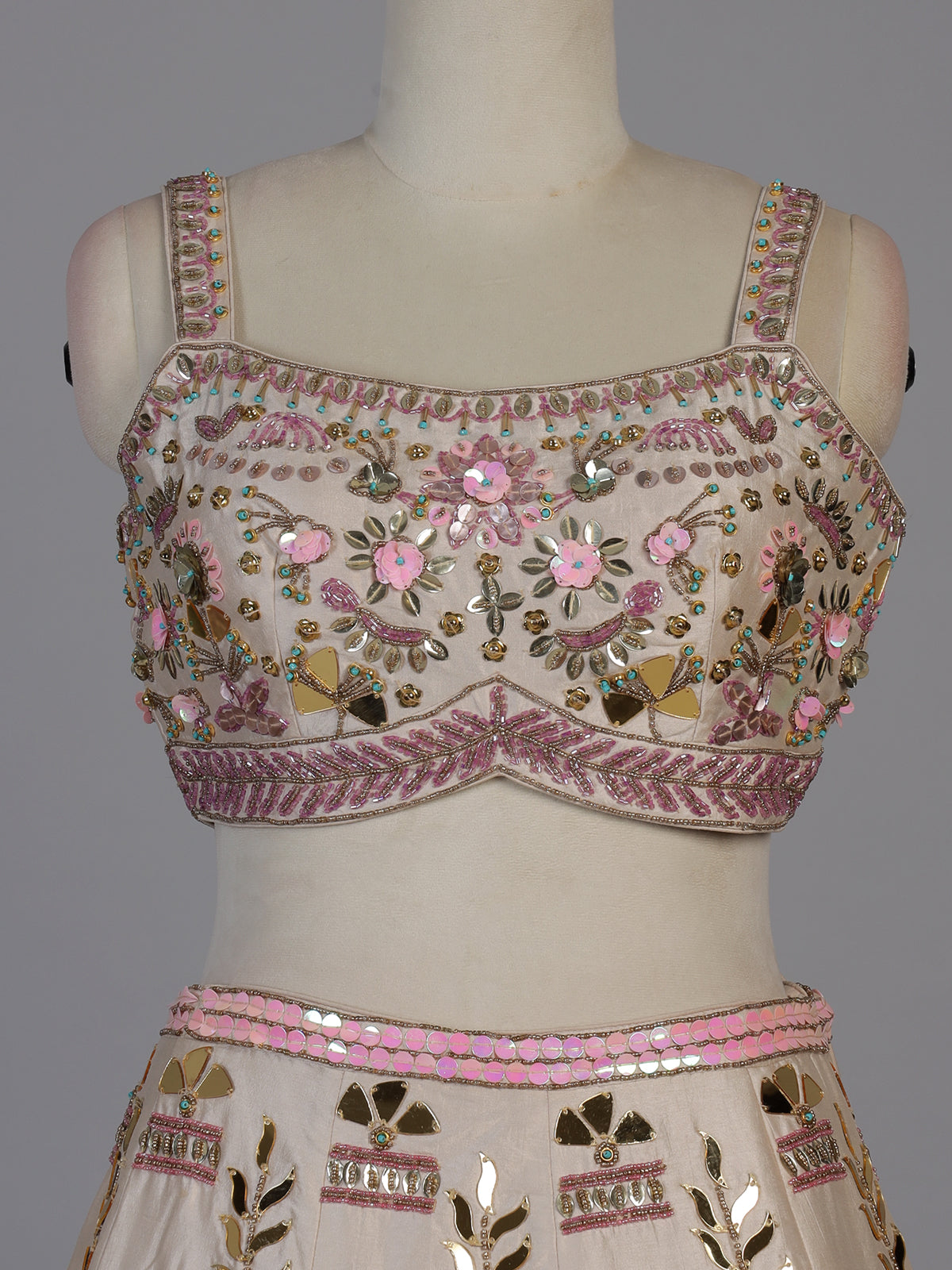 Beige silk lehenga choli with zardosi and mirror embellishments