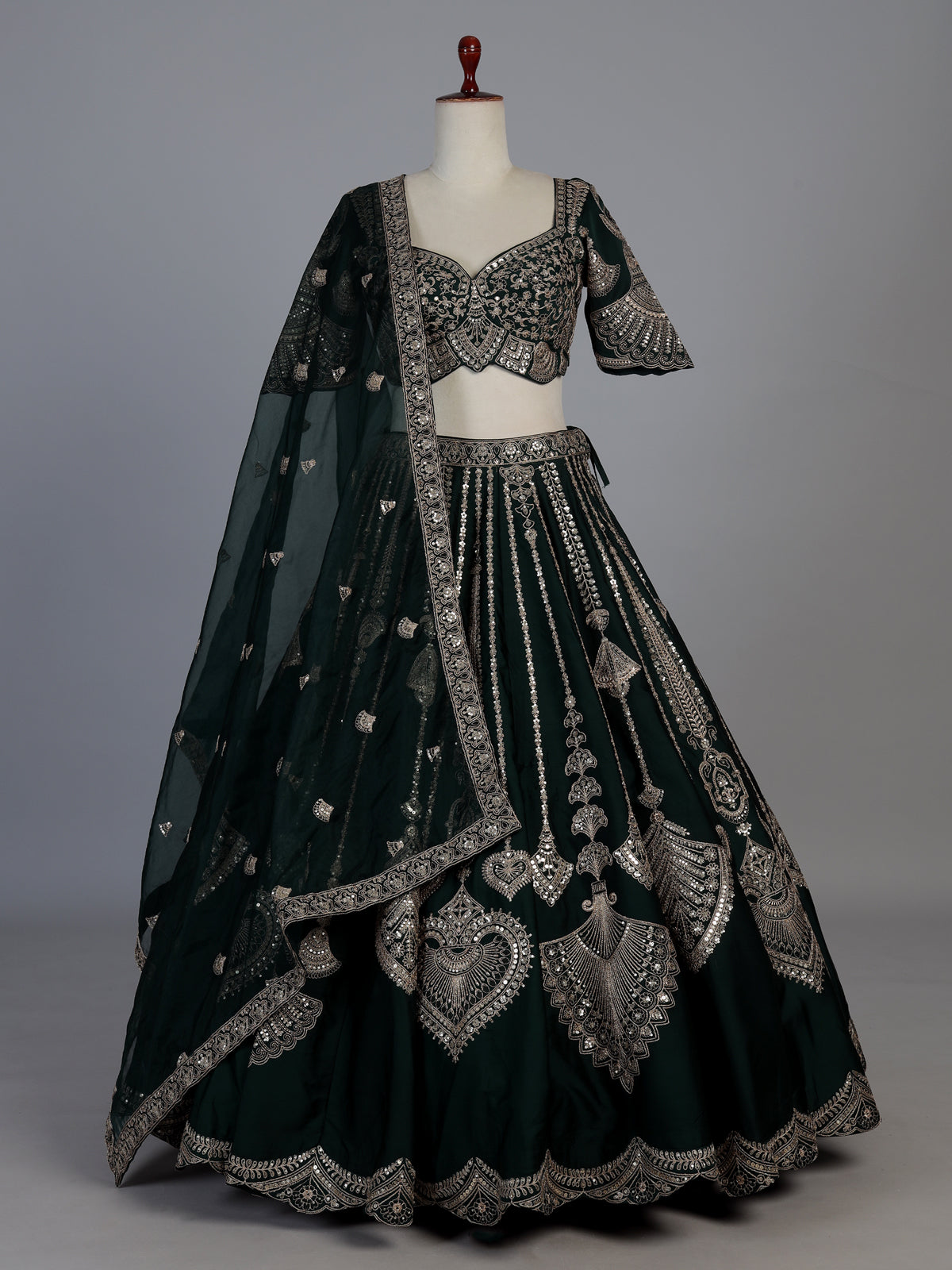 Bottle green silk lehenga choli with embroidered work and dupatta