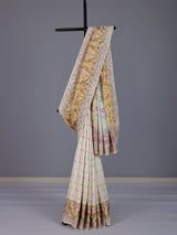 Cream patola silk saree with peacock motif contrast border and pallu