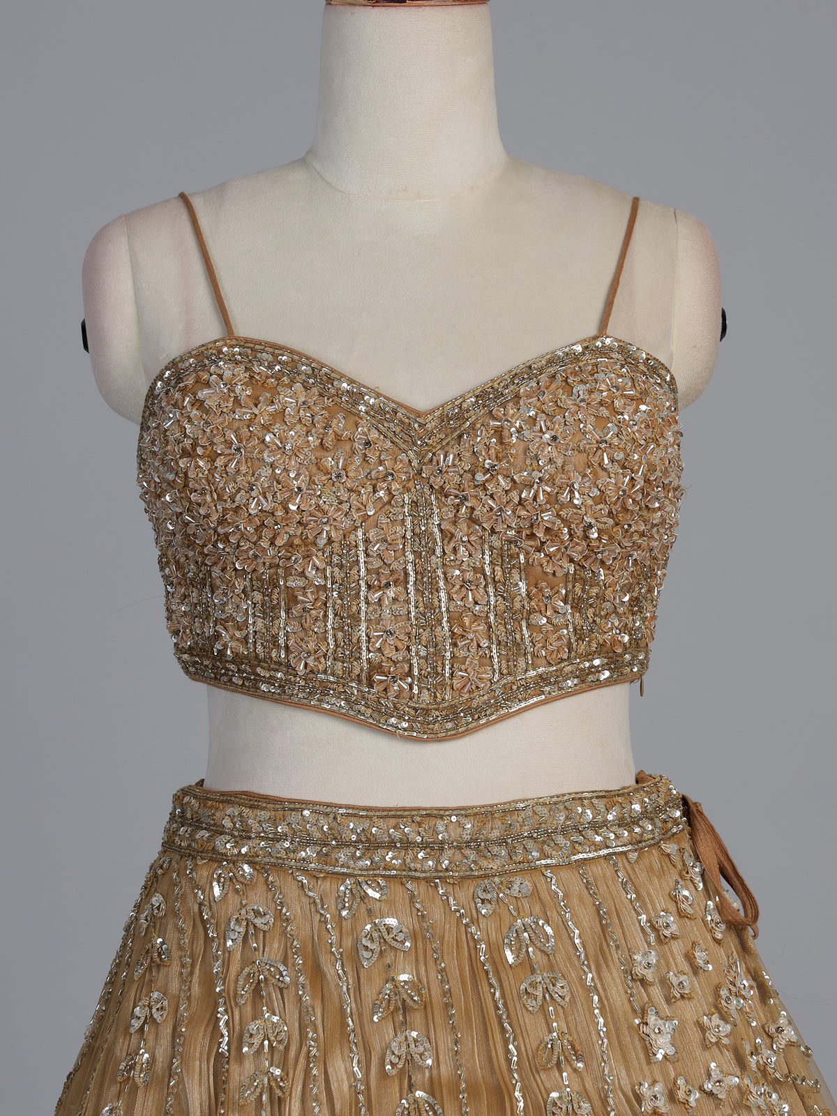 Dark beige net stone embellished festive lehenga choli