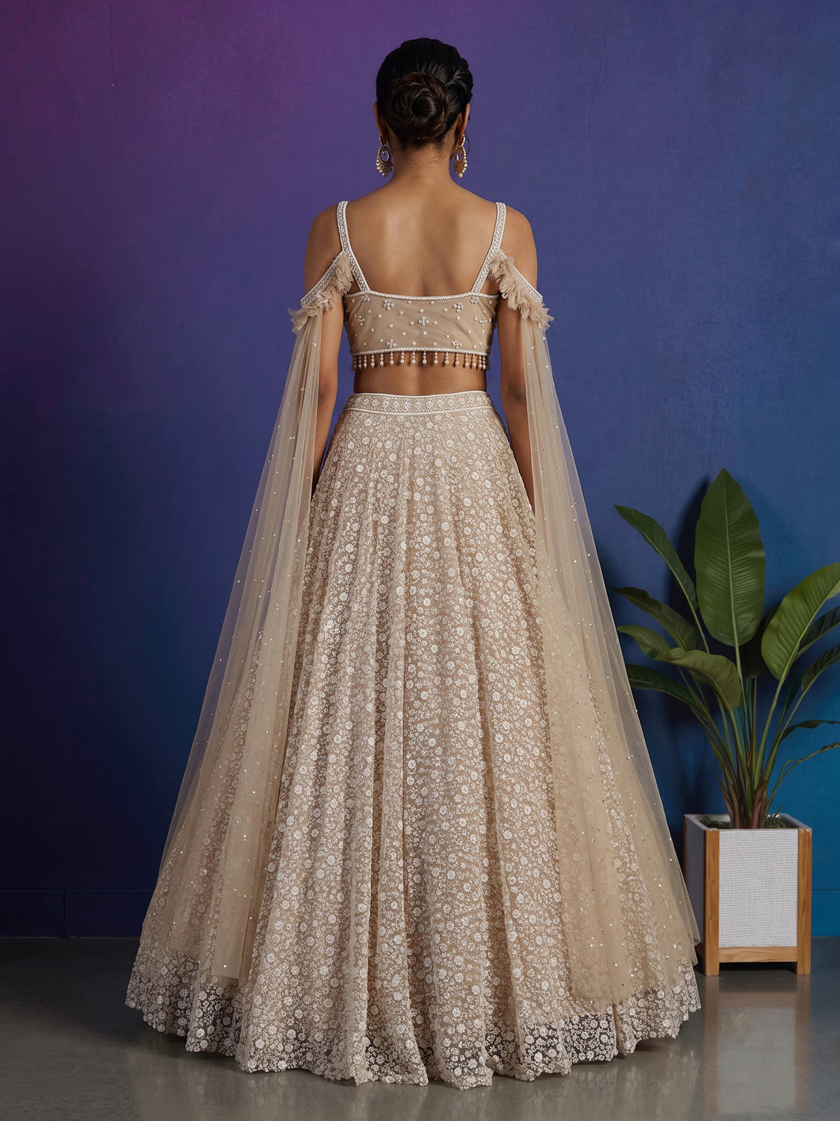 Beige net stone embellished bridal lehenga choli